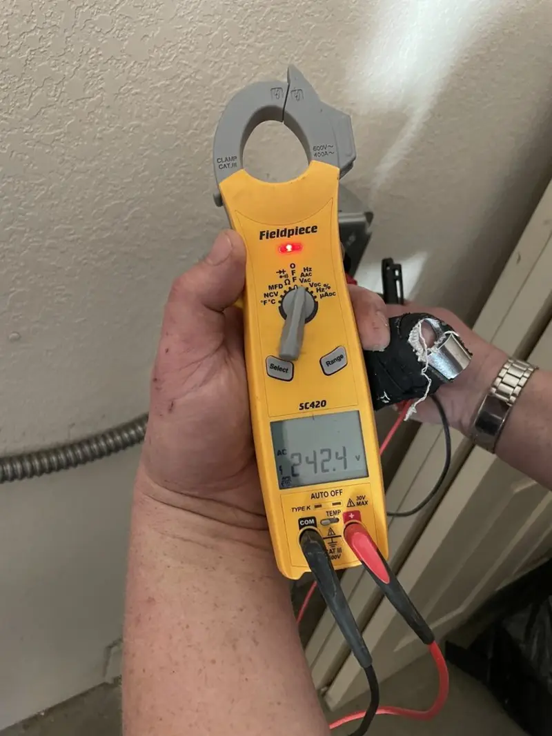 Voltage testing with clamp meter during Outlet Installation in Encinitas